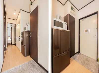 a room with a refrigerator and a microwave at Japan House Oshiage in Tokyo