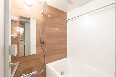 a bathroom with a shower with a white tub and a sink at \u7cf8\u3068365\u65e5 in Tokyo