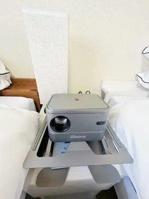 a printer sitting on a tray on a bed at \u30e1\u30be\u30f3\u30c9\u30ea\u30d0\u30fc\u30b8\u30e5205 in Tokyo