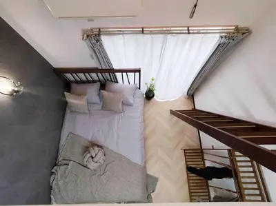 a bedroom with a bunk bed with a cat sitting on it at 202 Shinjuku center- 10mins from shinjuku st a- 2mins Okubo- Max6p-2room-\u6d89\u8c37\u516d\u672c\u6728\u94f6\u5ea7\u76f4\u8fbe in Tokyo