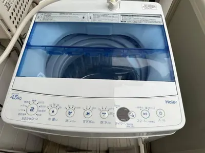a washing machine with its door open on a shelf at 202 Shinjuku center- 10mins from shinjuku st a- 2mins Okubo- Max6p-2room-\u6d89\u8c37\u516d\u672c\u6728\u94f6\u5ea7\u76f4\u8fbe in Tokyo