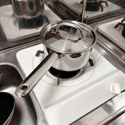 a tea pot sitting on top of a stove at Lucky House\u65b0\u5bbf11 in Tokyo