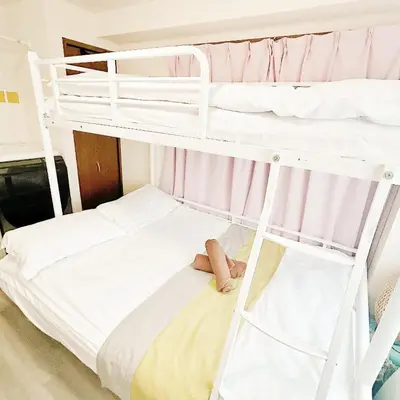 a bunk bed with a teddy bear on the bottom bunk at Lucky House\u65b0\u5bbf11 in Tokyo