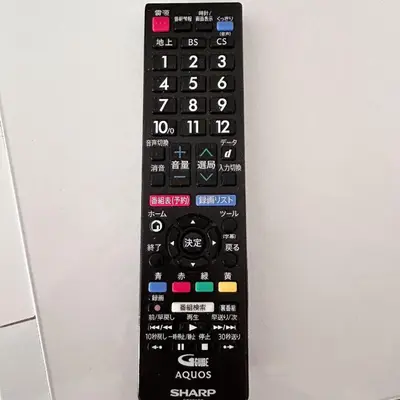 a remote control is attached to a wall at Lucky House\u65b0\u5bbf22 in Tokyo