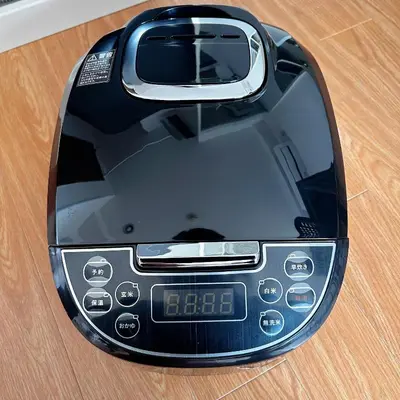 a black computer mouse sitting on top of a table at Lucky House\u65b0\u5bbf31 in Tokyo