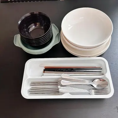 a white tray with forks and spoons and plates at Lucky House\u65b0\u5bbf31 in Tokyo