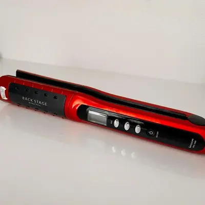 a red and black pen sitting on a table at Lucky House\u65b0\u5bbf31 in Tokyo