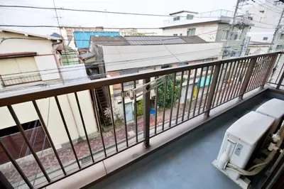 a balcony with a view of buildings at \u30d3\u30b9\u30bf\u6c60\u4e0a 301 in Tokyo