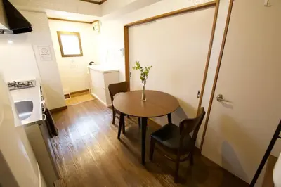 a small room with a table and chairs in it at \u30d3\u30b9\u30bf\u6c60\u4e0a 301 in Tokyo