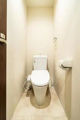 a bathroom with a white toilet in a stall at 29, Omori-kita, Private house rental, \u5927\u68ee\u5317 in Tokyo