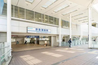 a large building with people walking inside of it at Ferio\u84b2\u7530III in Tokyo