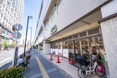 a street with bikes parked outside of a store at Ferio\u84b2\u7530III in Tokyo