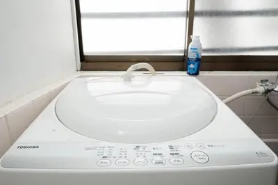 a white sink in a bathroom with a window at Shinjuku , 3min walk Okubo Sta, net, PocketWi-Fi, Switch in Tokyo