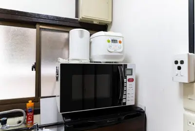 a microwave oven sitting on top of a counter at Shinjuku , 3min walk Okubo Sta, net, PocketWi-Fi, Switch in Tokyo
