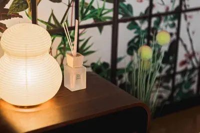 two white vases sitting on a wooden table with plants at Akihabara Area! Direct to Shibuya, Narita, Haneda in Tokyo