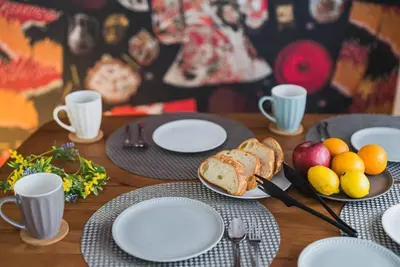 a table with plates of bread and fruit on it at Akihabara Area! Direct to Shibuya, Narita, Haneda in Tokyo