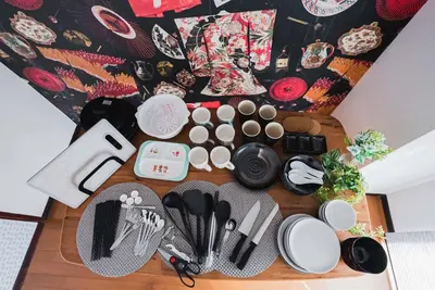 a table with plates and utensils on it at Akihabara Area! Direct to Shibuya, Narita, Haneda in Tokyo