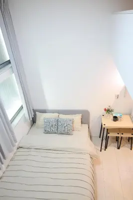 a small room with a bed and a table at \u5bbf\u6816\u6e0b\u8c37 in Tokyo