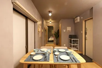 a dining room table with plates and bowls on it at \u3075\u3046\u308d\u3046 Furo in Tokyo