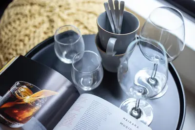a table with wine glasses and a book on it at \u3077\u3075\u304b\u6771\u5411\u5cf62 in Tokyo