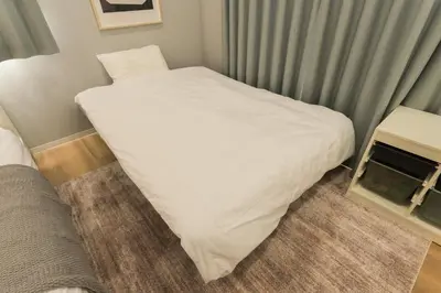 a large white bed in a small room at HOTEL Beruhigen Tokyo - Vacation STAY 93718v in Tokyo