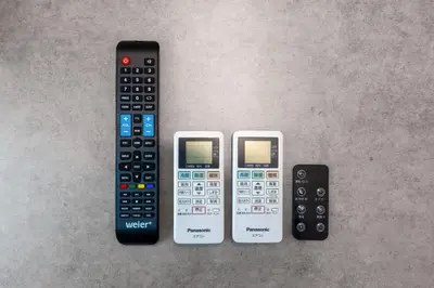 four remote controls are lined up next to each other at Mat\u91ce\u65b9 in Tokyo