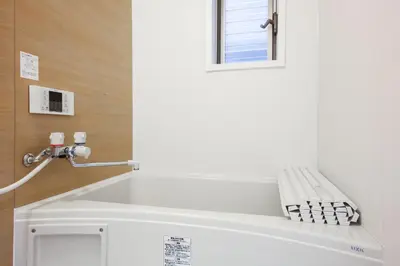 a white bathroom with a bench and a window at 3, Kameido, Entire house for rent, \u4e80\u6238 in Tokyo