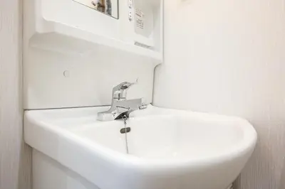 a bathroom with a sink and a white toilet at 3, Kameido, Entire house for rent, \u4e80\u6238 in Tokyo