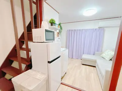 a small apartment with a staircase and a living room at Ikebukuro area, two layer house, double subway,3 min walk to stn, \u53cc\u5730\u94c1\u8f66\u7ad9\u6b65\u884c3\u5206 \u76f4\u8fbe\u65b0\u5bbf \u6da9\u8c37 \u94f6\u5ea7 \u6c60\u888b \u7687\u5c45 \u6700\u59276\u4eba in Tokyo