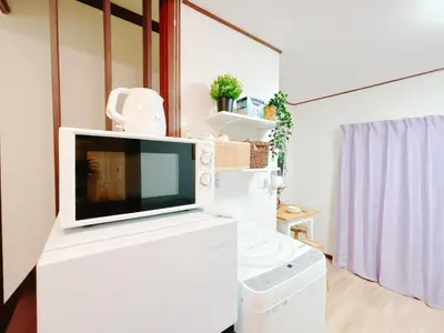 a tv sitting on top of a white refrigerator at Ikebukuro area, two layer house, double subway,3 min walk to stn, \u53cc\u5730\u94c1\u8f66\u7ad9\u6b65\u884c3\u5206 \u76f4\u8fbe\u65b0\u5bbf \u6da9\u8c37 \u94f6\u5ea7 \u6c60\u888b \u7687\u5c45 \u6700\u59276\u4eba in Tokyo