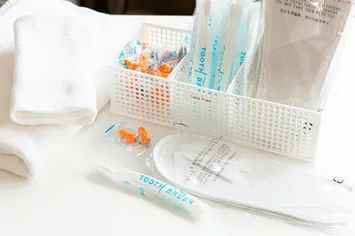a basket of toothpaste and toothbrushes on a counter at Dormitory Kinshu - \u30c9\u30df\u30c8\u30ea\u30fc\u9326\u7e4d in Tokyo