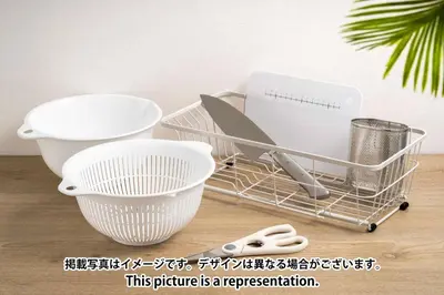a shopping cart with bowls and utensils on a table at \u30a2\u30a4\u30c7\u30a3\u84b2\u7530\u897f in Tokyo