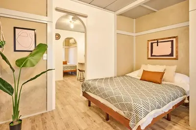 a bedroom with a bed and a large mirror at \u548c\u6c23\u4f1a\u3005\u91ce\u65b9 Wakiaiai Nogata in Tokyo