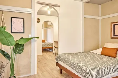 a bedroom with a bed and a mirror at \u548c\u6c23\u4f1a\u3005\u91ce\u65b9 Wakiaiai Nogata in Tokyo