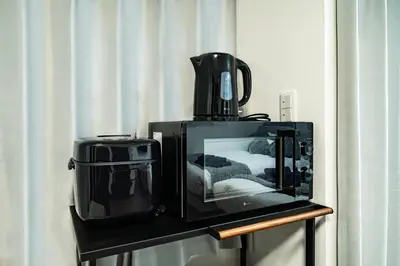 a tv sitting on a shelf with a blender at 66, Omori-Nishi, Entire house for rent, \u5927\u68ee\u897f in Tokyo