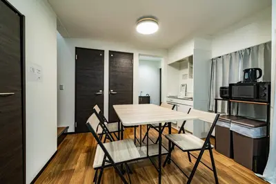 a kitchen and dining room with a table and chairs at 66, Omori-Nishi, Entire house for rent, \u5927\u68ee\u897f in Tokyo