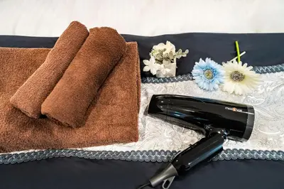 a close up of two towels and a hair dryer at 66, Omori-Nishi, Entire house for rent, \u5927\u68ee\u897f in Tokyo