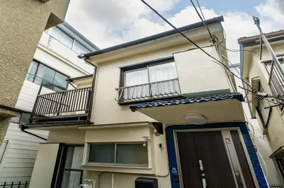 a building with a door and a balcony at 66, Omori-Nishi, Entire house for rent, \u5927\u68ee\u897f in Tokyo
