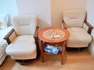 a room with two chairs and a table and a bed at Mamada Building - Vacation STAY 16945 in Tokyo
