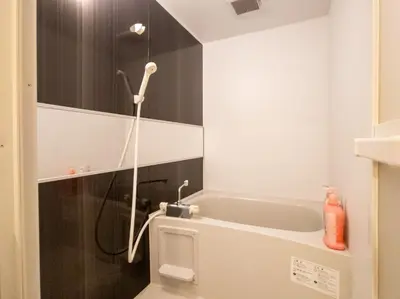 a bathroom with a shower and a bath tub at Mamada Building - Vacation STAY 16945 in Tokyo
