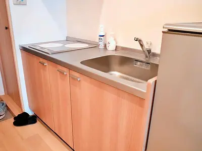 a kitchen with a sink and a refrigerator at Mamada Building - Vacation STAY 16945 in Tokyo