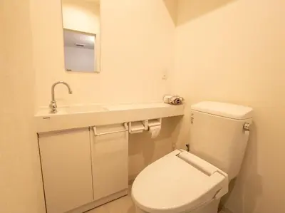 a bathroom with a white toilet and a sink at Mamada Building - Vacation STAY 16945 in Tokyo