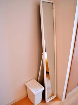 a bathroom with a mirror next to a toilet at Mamada Building - Vacation STAY 16945 in Tokyo