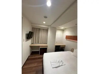 a hotel room with a bed and a desk at ELE HOTEL HIGASHI NIHONBASHI - Vacation STAY 01234v in Tokyo