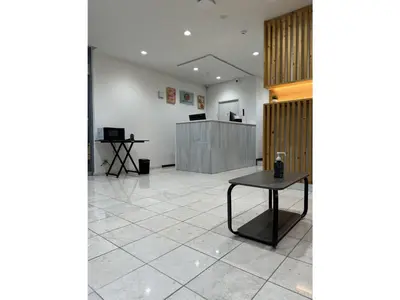 an empty lobby with a table in the middle at ELE HOTEL HIGASHI NIHONBASHI - Vacation STAY 01234v in Tokyo