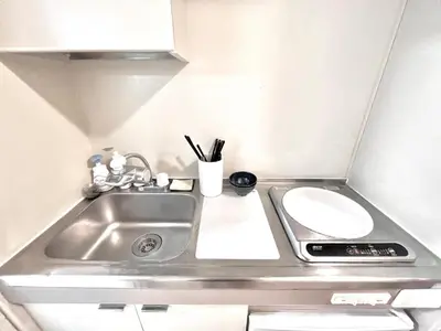 a small kitchen with a sink and a counter at Ikebukuro Sugamo \u99c5\u8fd1 A4 in Tokyo