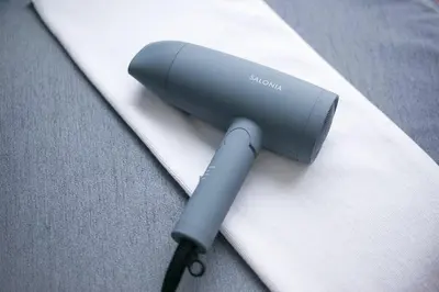 a blow dryer sitting on top of a piece of paper at \u3077\u3075\u304b\u6771\u5411\u5cf63 in Tokyo
