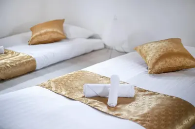 two beds with a cross on top of them at \u3077\u3075\u304b\u6771\u5411\u5cf63 in Tokyo