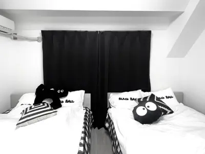 two beds with stuffed animals on them in a room at Ikebukuro Sugamo \u99c5\u8fd1 C02 in Tokyo