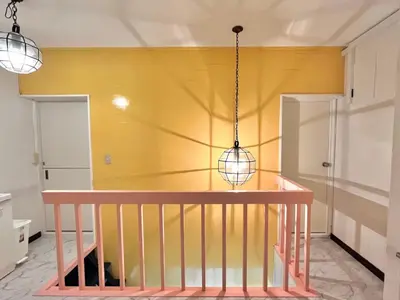 a dining room with a table and a yellow wall at \u6c60\u888b2\u5206\u6700\u592712\u4eba\u53ef in Tokyo